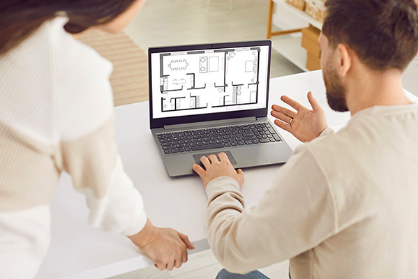 Homebuyers viewing a floorplan